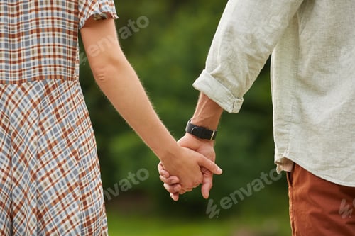 Preview: Romantic Couple Holding Hands Close Up
