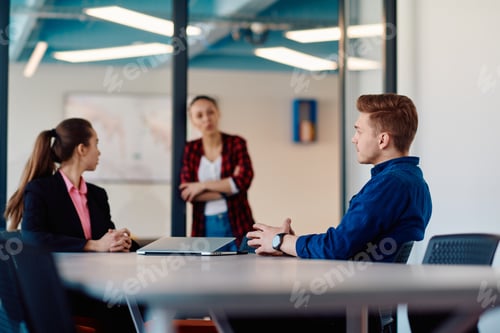 Preview: A team of successful programmers sits in a startup office, strategizing new business projects and
