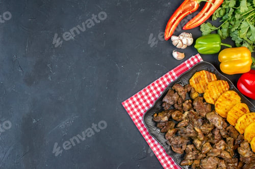 Preview: top view tasty kebab with potato on platter bell peppers coriander garlic on dark background with