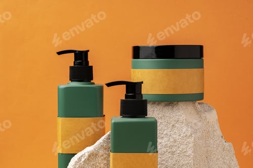 Preview: Dark green plastic bottles for skincare cosmetics on yellow background