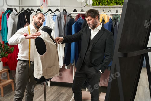 Preview: Two Men Working on Fashion in Clothing Store