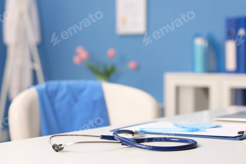 Preview: Doctor's workplace. Stethoscope, clipboard and pen on white table in medical office, closeup