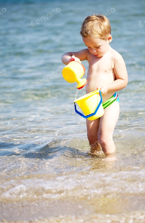 Preview: Adorable little boy playing in the sea