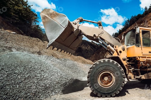 Preview: Heavy duty machinery loading gravel and transporting materials
