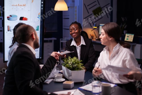 Preview: Diverse multi-ethnic businesspeople overworking late at night