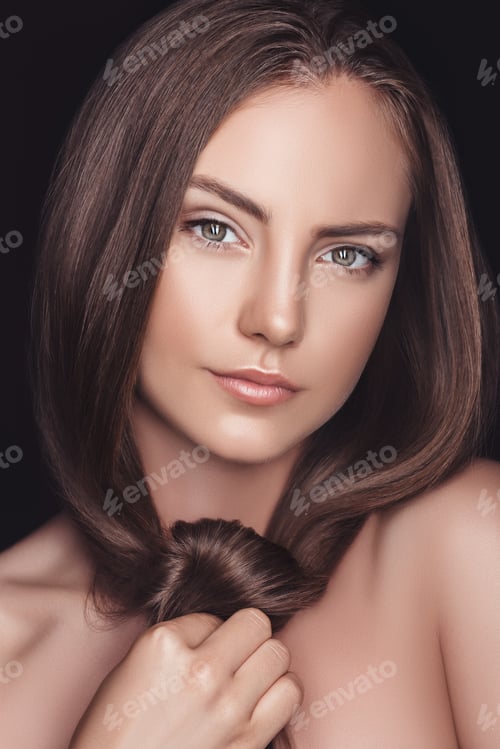 Preview: portrait of beautiful young caucasian woman with long hair isolated on black