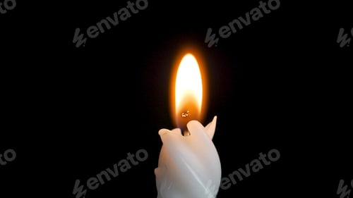 Preview: White long candle on black background. Single candle flame light. Long flame, old candle. White