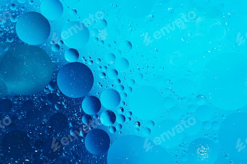Preview: oil with bubbles on on dark blue background. Abstract background.