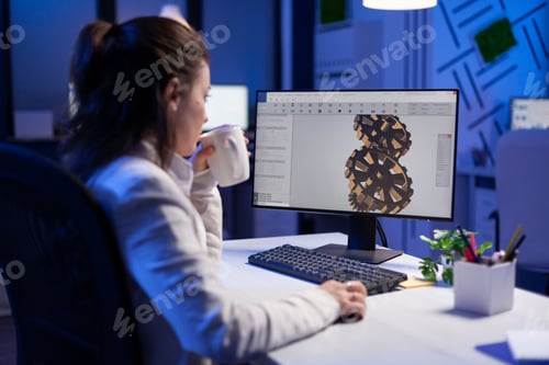 Preview: Focused architect working at new project using computer doing gear prototype