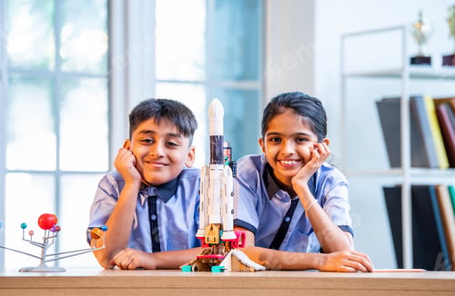 Preview: Indian students explore space rocket model in classroom while learning aerospace concepts in uniform