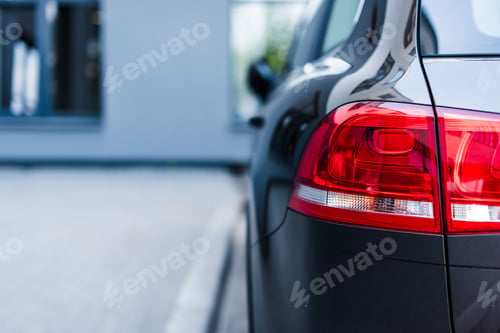 Preview: Red brake lights of car on street