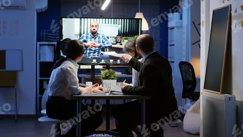 Preview: Multi ethnic businesspeople discussing with remote entrepreneur in wheelchair during online