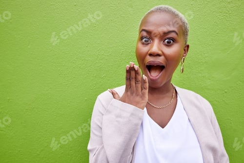 Preview: Surprise, happy and portrait of black woman by green wall with gossip, good news or secret. Shock,