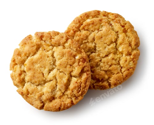 Two freshly baked golden oatmeal cookies