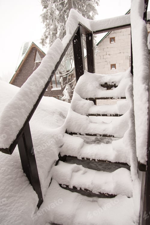 Preview: Winter snow stairs. Wooden staircase of a private house. A lot of snow. Winter.