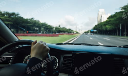 Preview: People driving car on city road