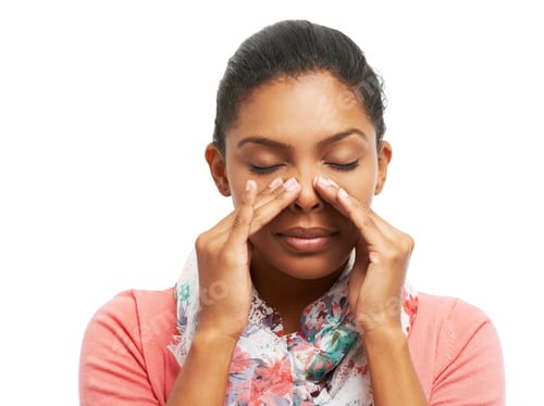 Preview: A pretty young woman battling sinus problems while isolated on a white background