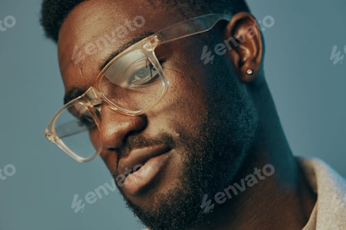 Preview: Close up portrait of an African American man wearing stylish glasses, showcasing a confident