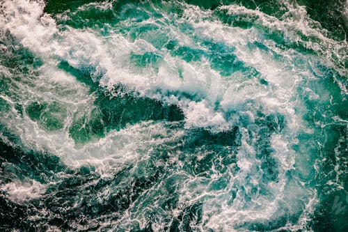 Preview: Blue waves of water of the river and the sea meet each other during high tide and low tide.