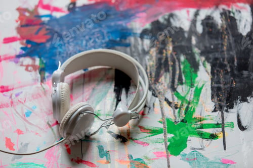 Preview: Classic cable headphones on art paint. Above view