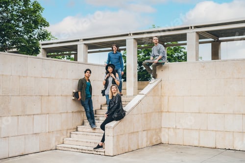 Preview: Group of young multiethnic friends posing outdoor