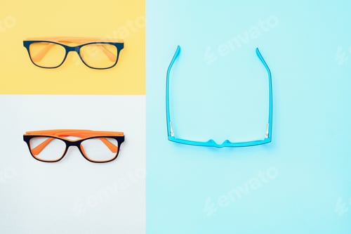 Preview: Stylish eyeglasses over background. Optical store, glasses selection