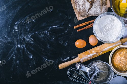 Preview: Ingredients and utensil for baking on the black board, top view