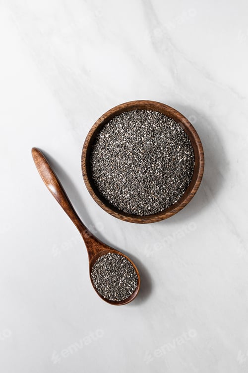 Preview: Close-up of chia seeds in a glass jar with a wooden spoon