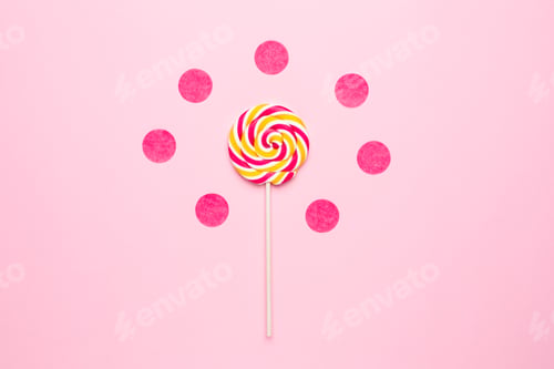 Preview: Colorful lolipop with wooden stick, pink, yellow and white spiral on pink background