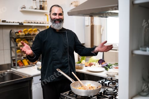 Preview: Chef working in kitchen