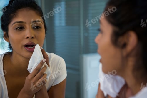 Preview: Young woman wiping face