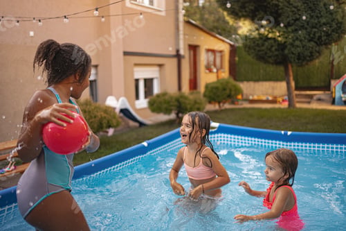 Preview: Children enjoying a playful afternoon in an inflatable pool