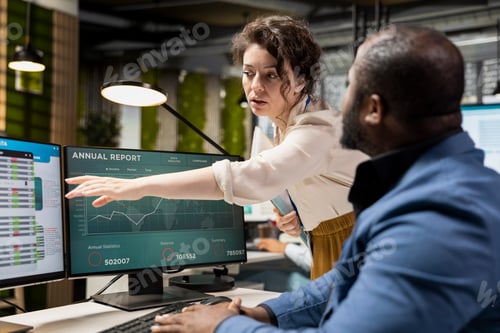 Preview: Multiethnic employees focusing on insights management on pc