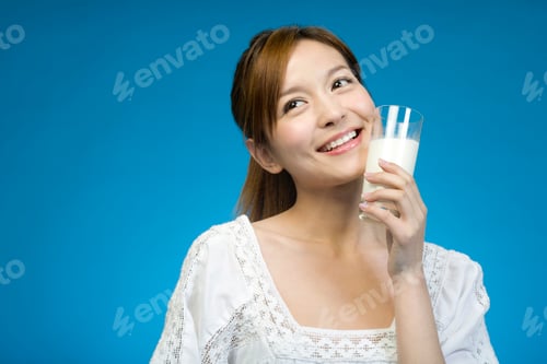 Preview: Chinese woman in white drinking milk on blue background