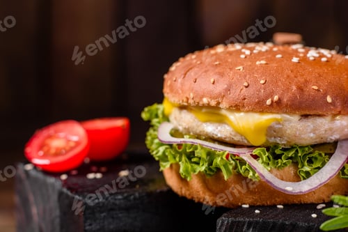 Preview: Delicious fresh homemade burger on a wooden table