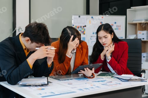 Preview: Businessman team working are under stress from financial data and report graph.