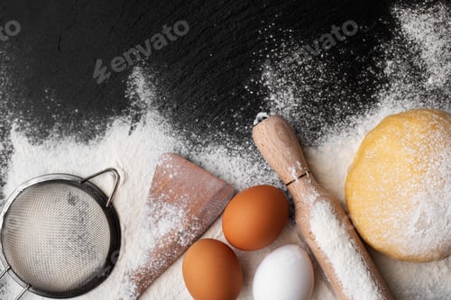Preview: Baking utensils and dough laying on flour flat lay view with copyspace