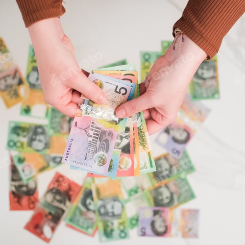 Preview: Australian dollar banknotes in the hands. on the white background