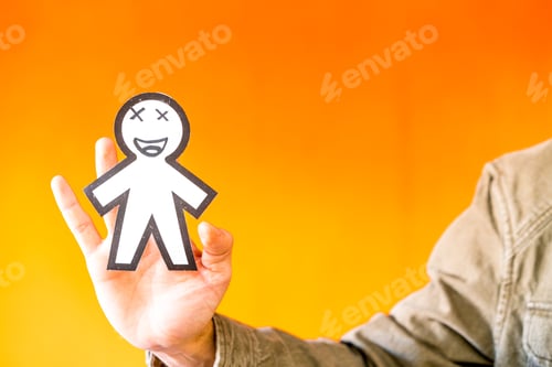 Preview: Smiling man holding funny paper toy