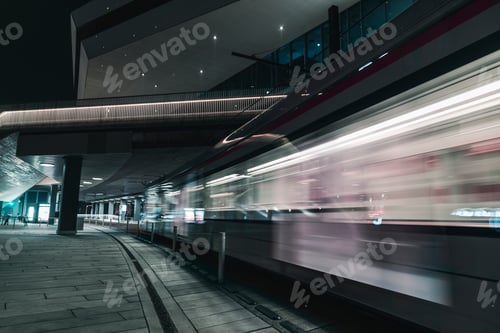 Preview: Electric railway train passing by DOKK1 public building, Aarhus, Midtjylland, Denmark