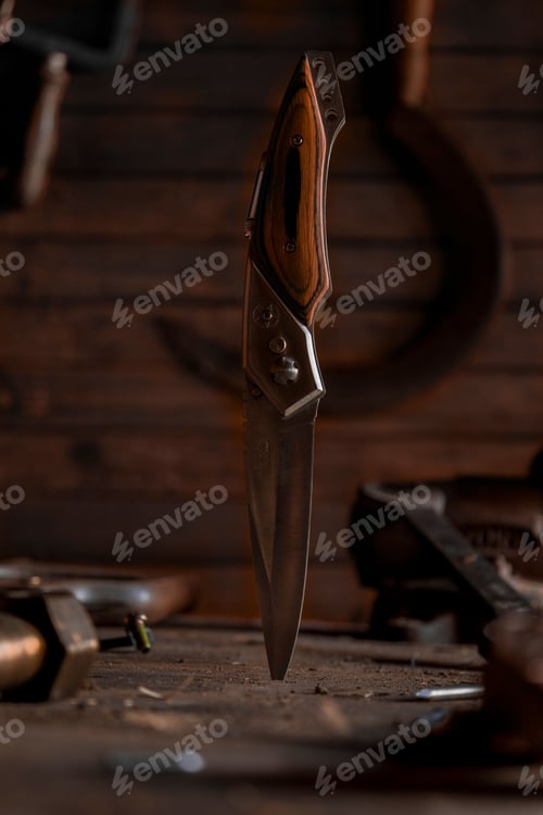 Preview: Vertical shot of a blade knife with real wooden handle
