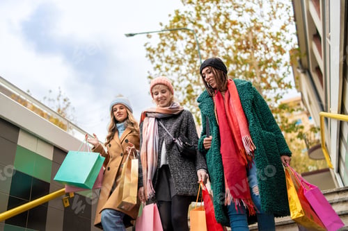 Preview: Diverse friends enjoying autumn shopping, urban lifestyle and inclusivity concept