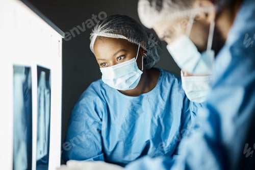 Preview: Doctors Examining X-Ray in Hospital Setting