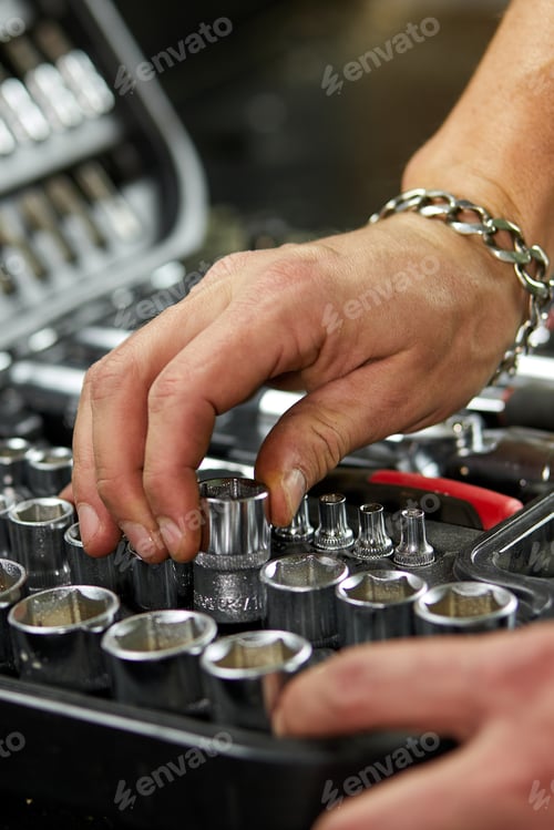 Preview: Man hand open set box with working tools