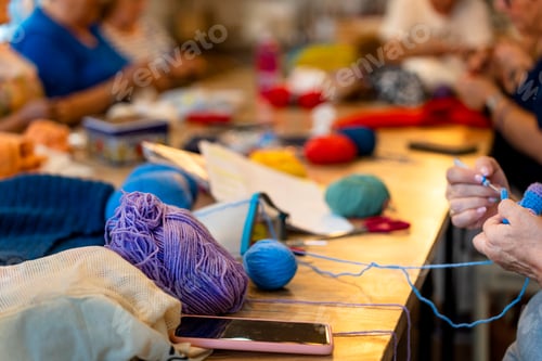 Preview: Crochet club. Ladies crocheting with colored wool.