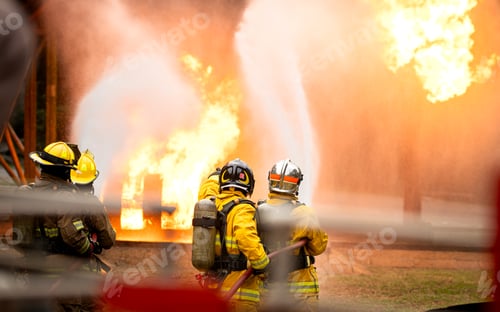 Preview: A group of firefighters uses high-pressure hoses to battle a massive blaze
