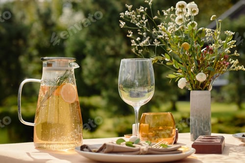 Preview: Refreshing Summer Drink and Table Setting Awaiting Outdoor Garden Gathering