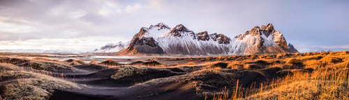Preview: Panoramic view of mountains over remote fields