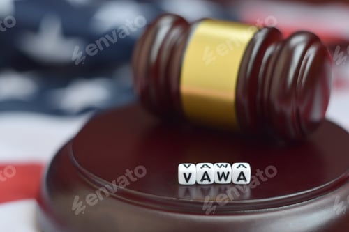 Preview: Justice mallet and VAWA acronym close up. Violence against women act
