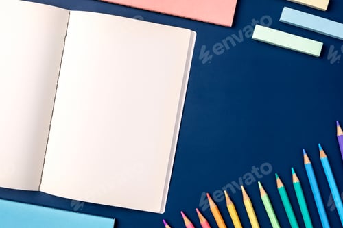 Preview: top view pastel notebook with pencil and stationery on navy blue table background